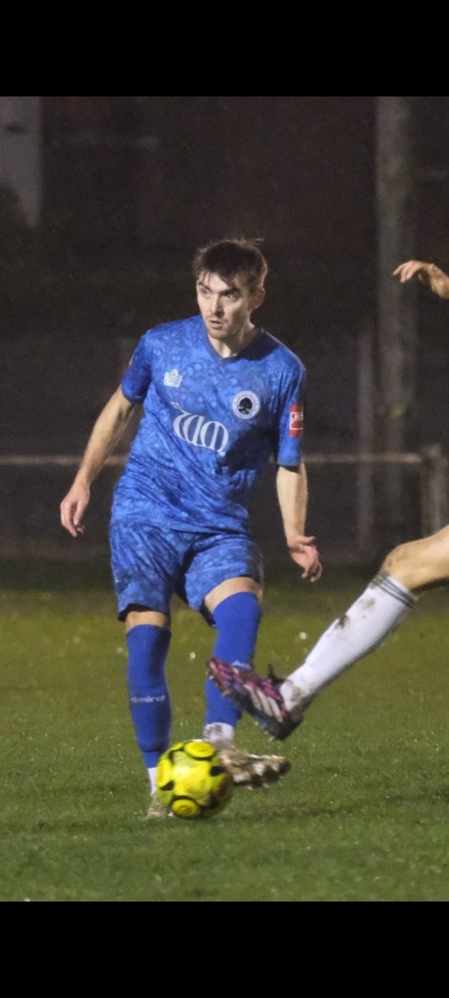 Elliot playing football in a blue kit
